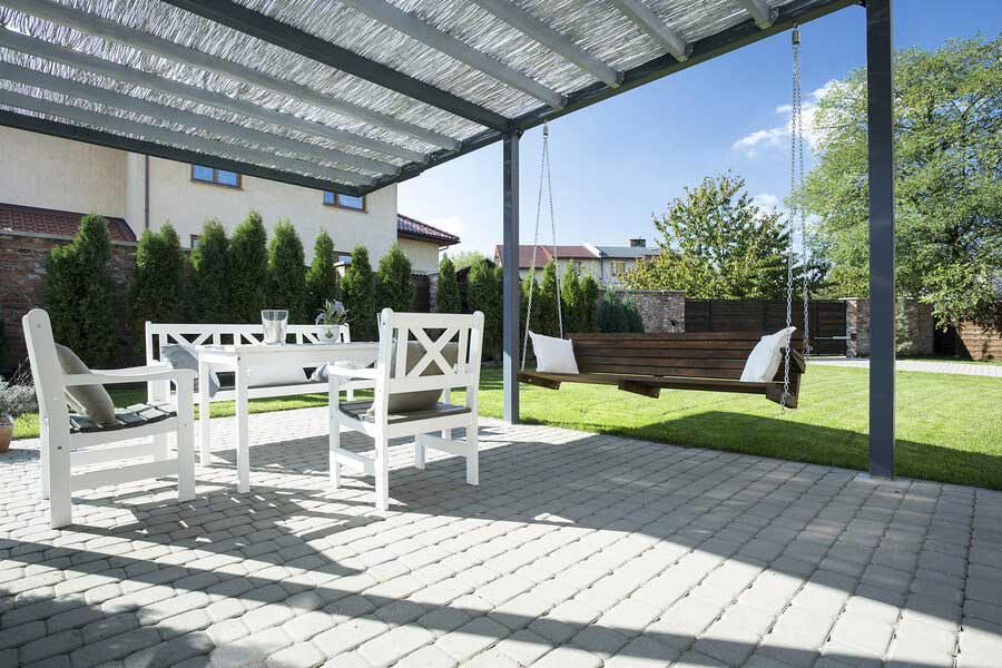 Beautiful patio with white table sitting and wooden swing