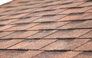 Close up of new roof with asphalt shingles